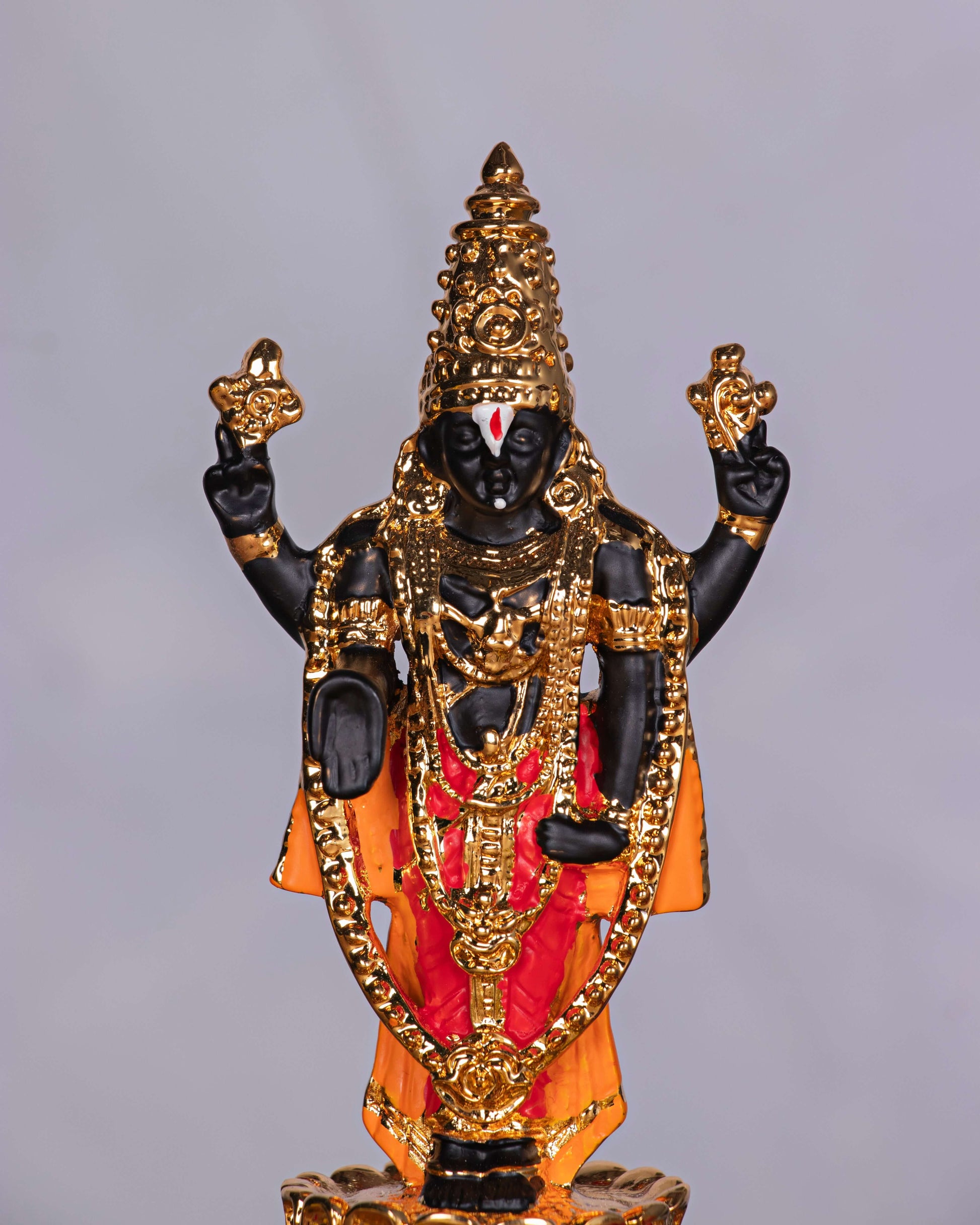 Gold-plated idol of Lord Tirupati Balaji (Venkateswara) standing with ornate details.