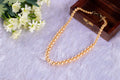 Sea Shell Pearl Necklace in Gold Color half in the wooden box