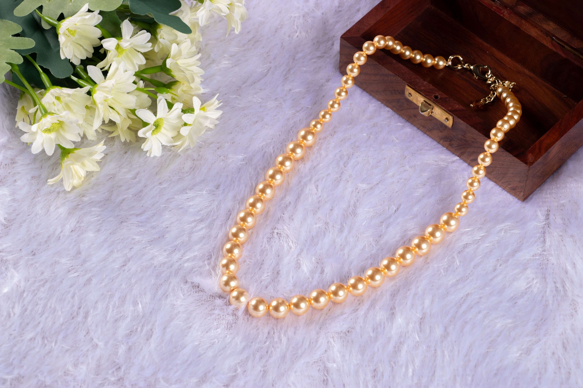 Sea Shell Pearl Necklace in Gold Color half in the wooden box