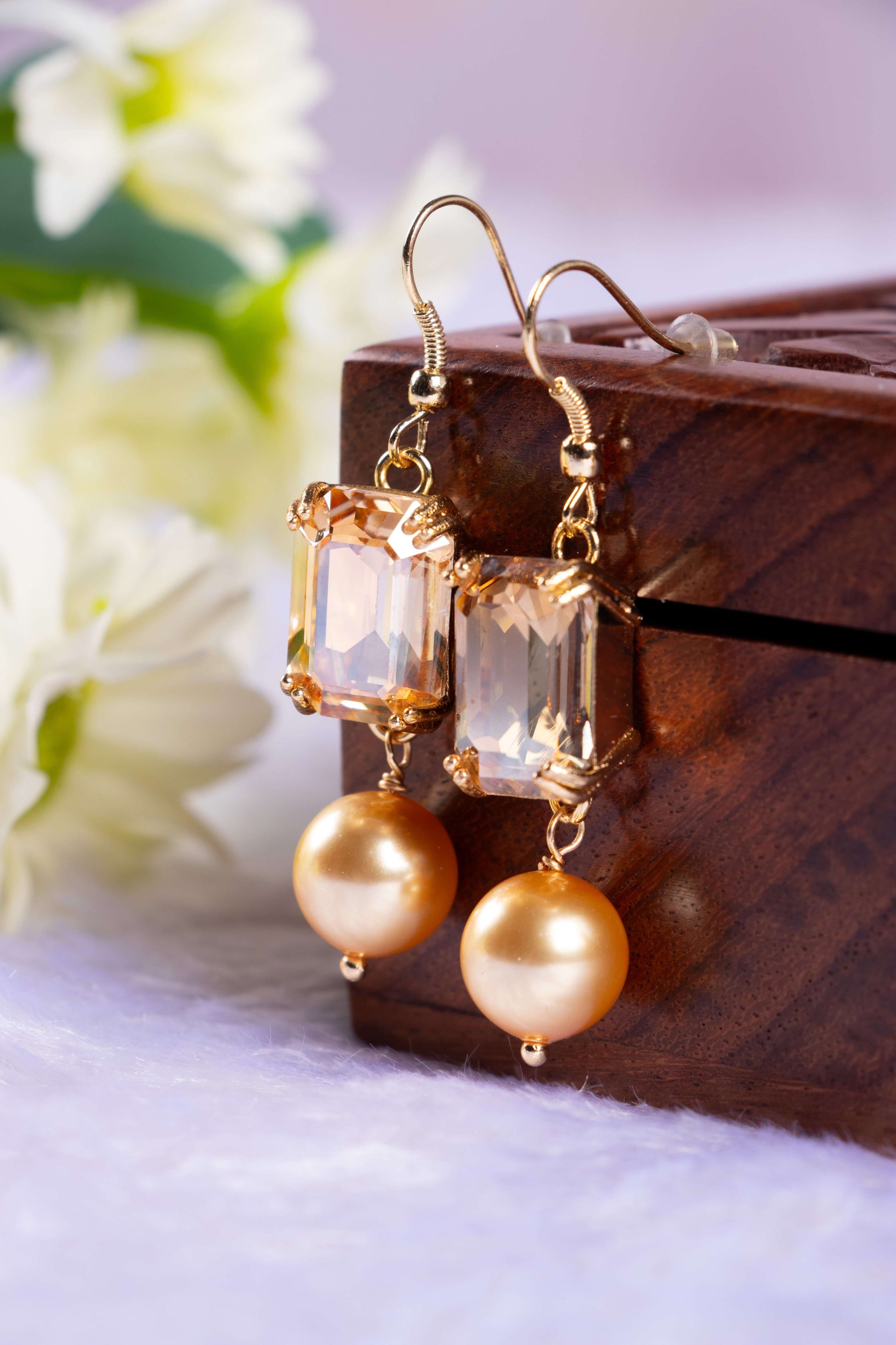 2 Stone Swarovski Crystal Elements Drop Stud Earring hanged on the wooden box