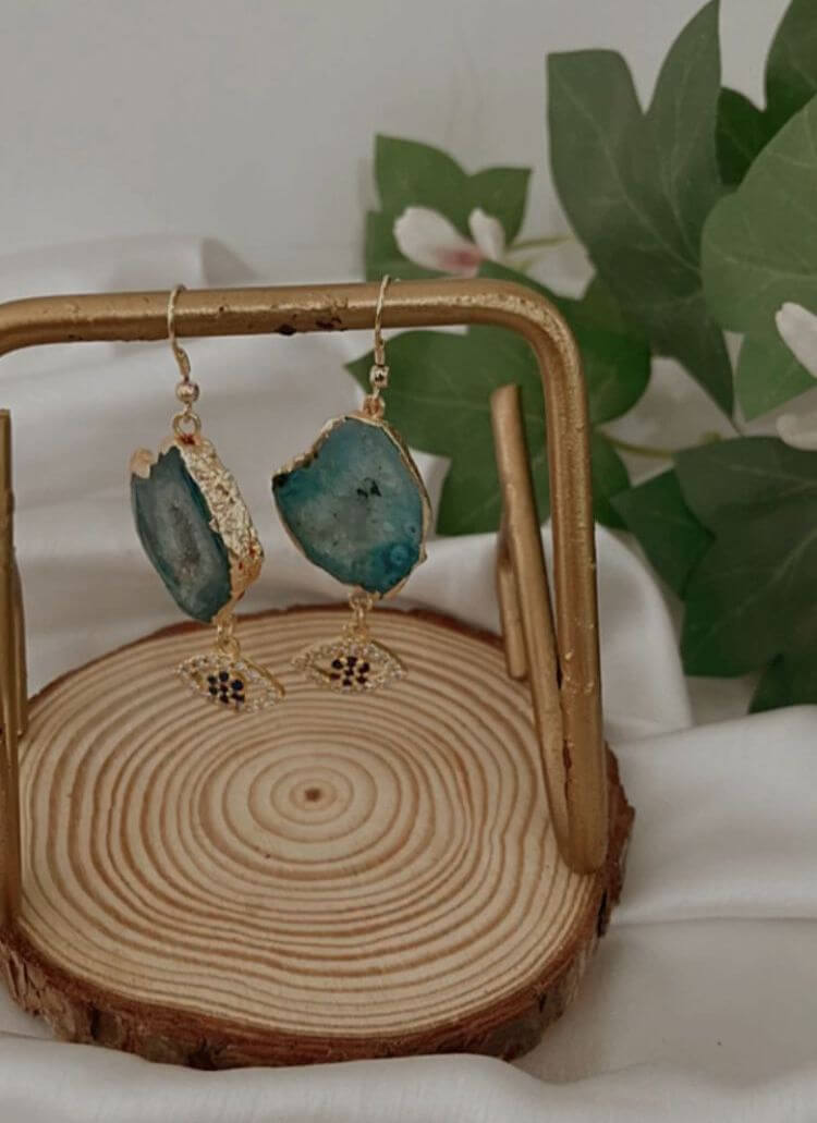 Agate Earrings hanging on the wooden base