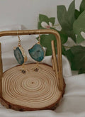 Agate Earrings hanging on the wooden base