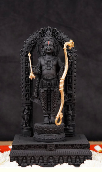 A meticulously crafted black idol of Ram Lalla, depicting Lord Rama in his childhood form, standing on a detailed pedestal and adorned with intricate gold-plated bow and arrow.