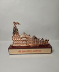 Close-up of a decorative Ram Mandir Ayodhya idol, showcasing its distinct spire, multiple shikharas, and the text 'Shri Ram Mandir Ayodhya' on the base.