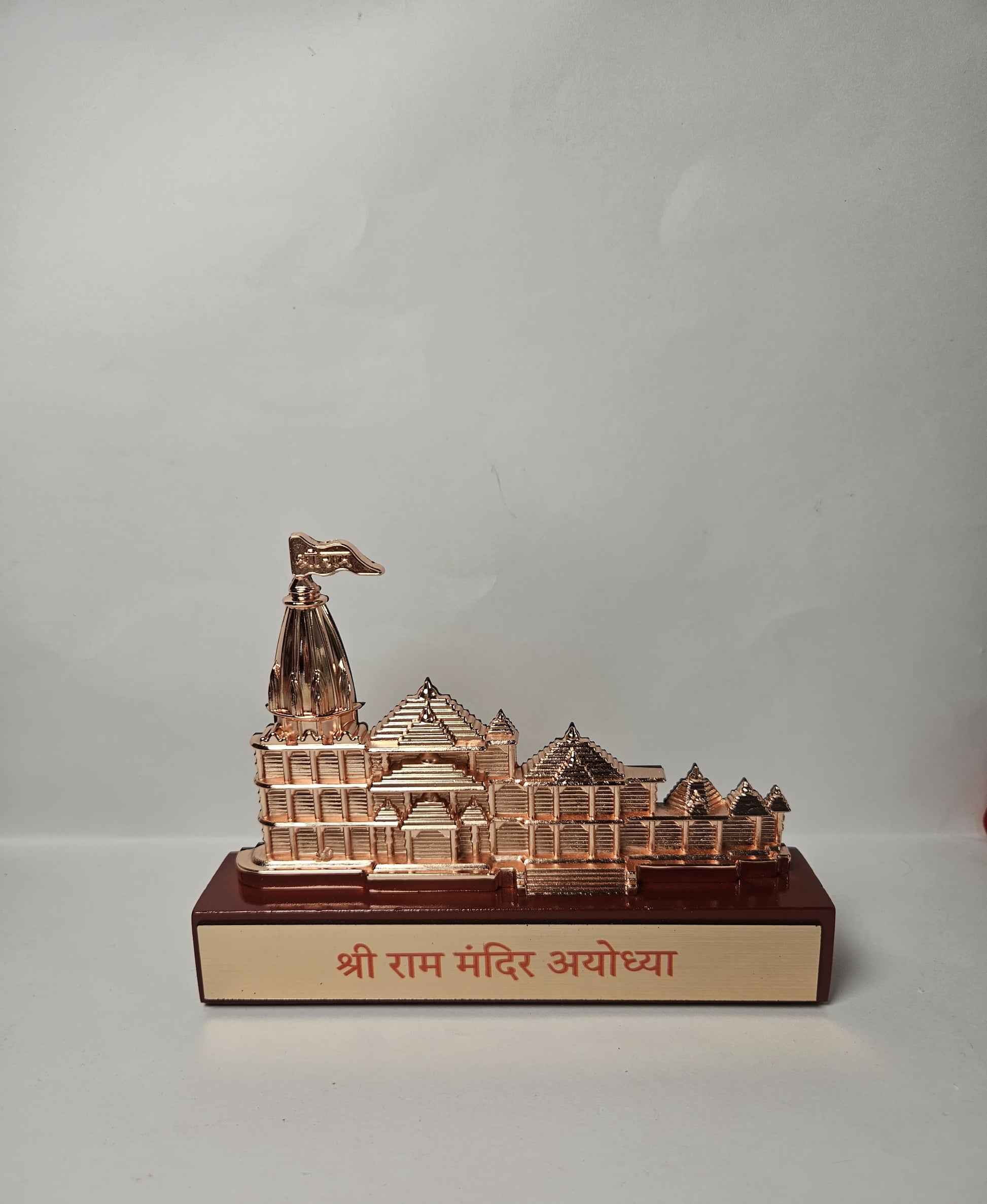 Detailed rose gold Ram Mandir design for home decor