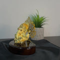 Yellow color Ganapati ji with golden kalpvruksh behind