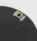 Back of a round mirror showing a metal hanging bracket with a keyhole slot and screw holes.