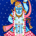 A vibrant Pichwai painting of Shrinathji, a form of Lord Krishna, with blue skin, adorned in colorful traditional attire and elaborate jewelry, set against a deep blue background with white dot patterns.
