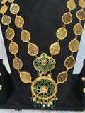 A gold-colored double layered filigree petals necklace on the black showpiece.