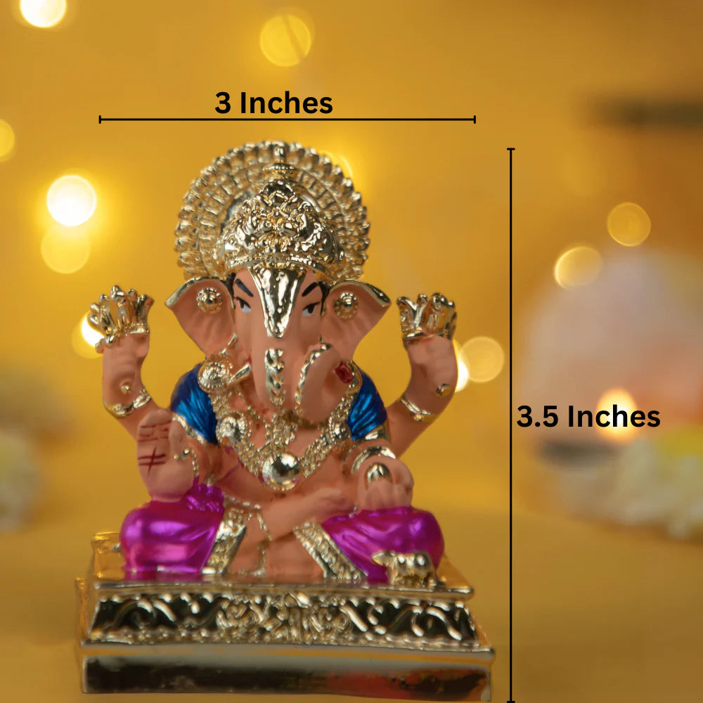 decorative Dagdusheth Ganpati Idol, a seated Ganesha statue that is 3 inches wide and 3.5 inches tall, with a pinkish-orange body, blue clothes, and gold accents. The idol sits on a gold base with a decorative halo behind the head. It is a popular idol, often used for home decor, worship, or as a gift.