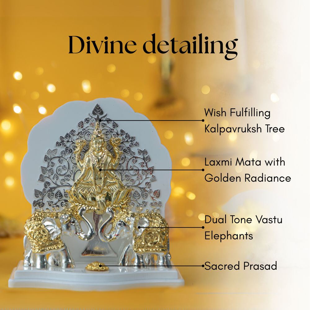 An image of a Gajalakshmi idol with intricate detailing, featuring the goddess Lakshmi seated on a lotus with golden radiance, flanked by two dual-tone elephants, and a Wish Fulfilling Kalpavruksh Tree behind her. The base includes a Sacred Prasad.