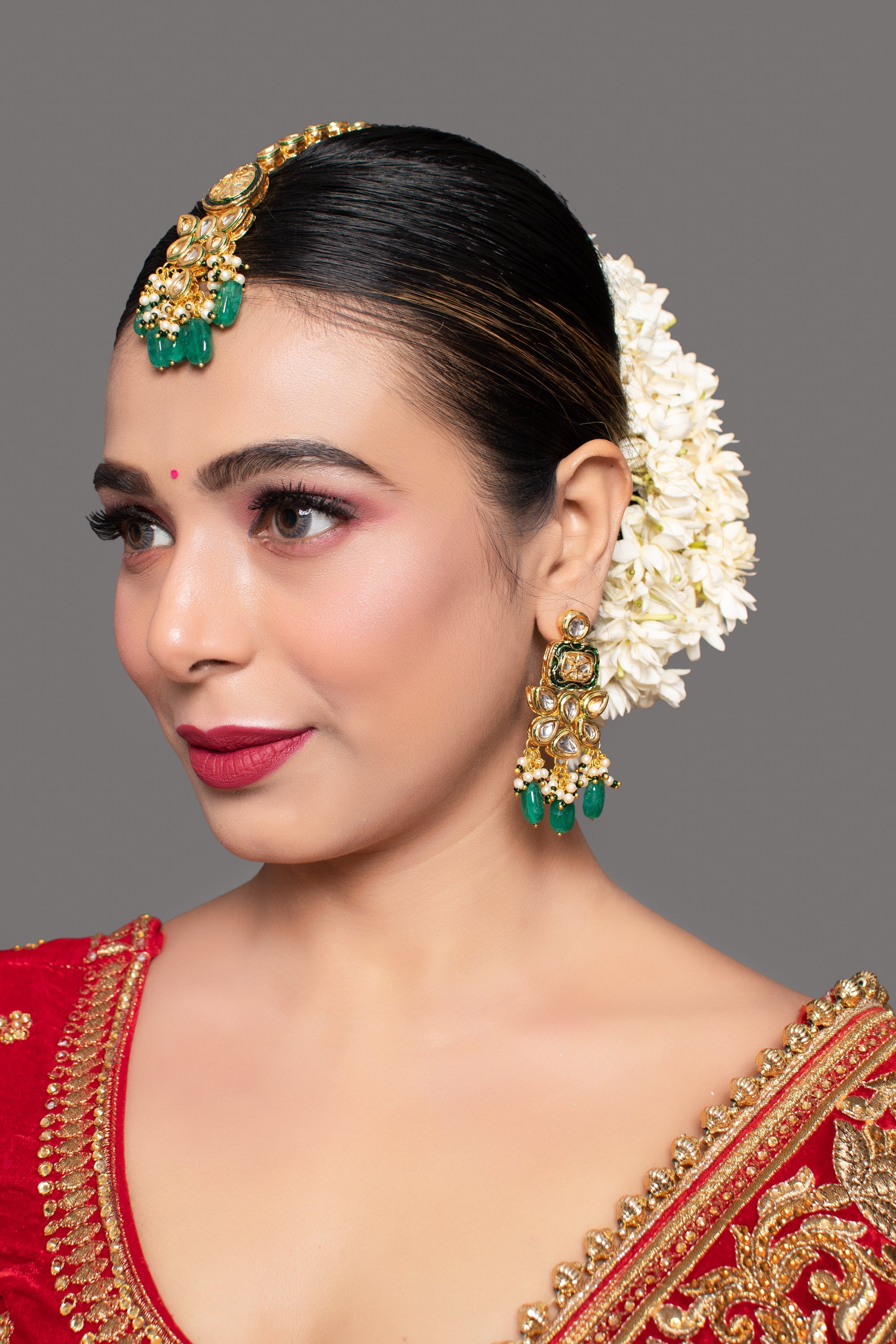 Green Gold toned Kundan earrings with Maang Tikka
