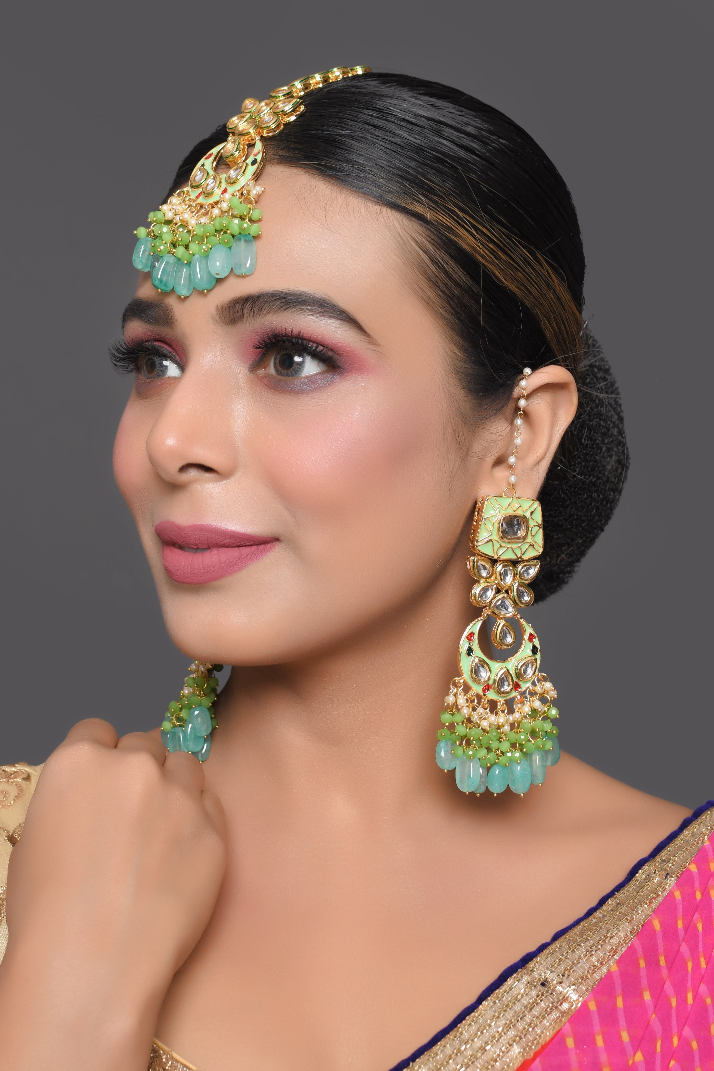 Green enameled Kundan earrings with Maang Tikka