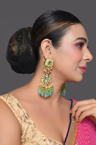Gold toned Green Kundan studded & enameled handcrafted earrings