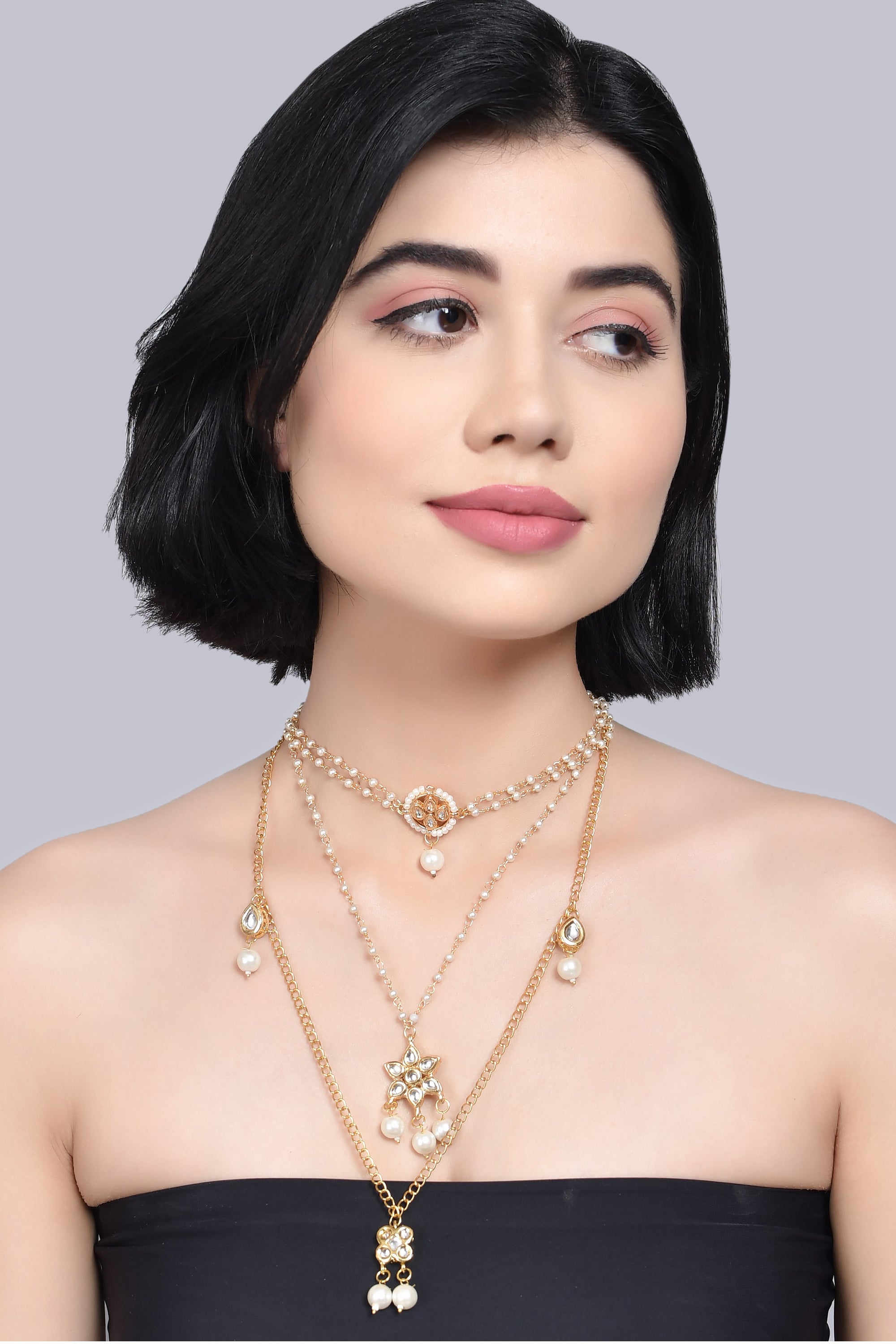 Multilayered pearl beaded Kundan embellished necklace teamed with choker