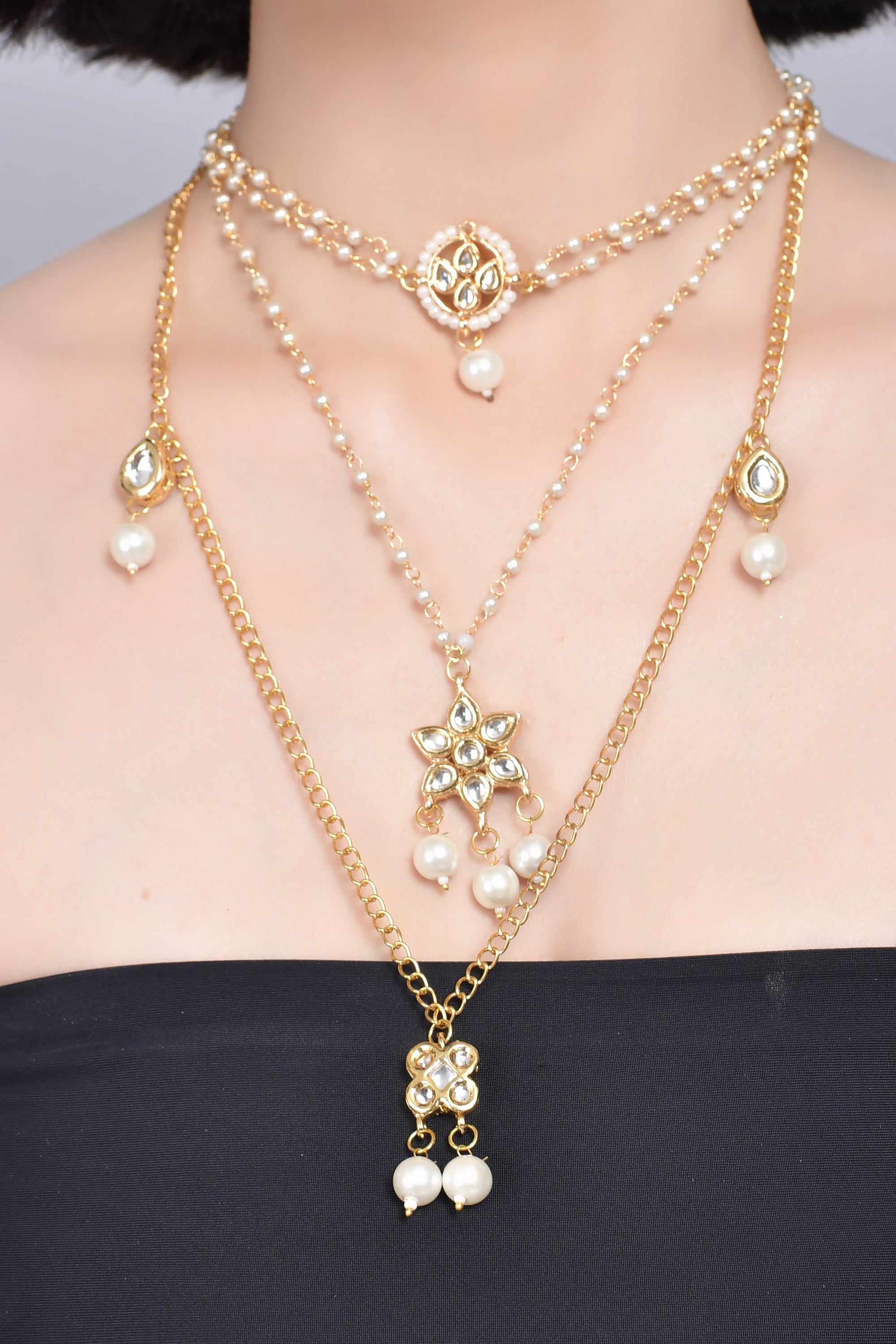 Multilayered pearl beaded Kundan embellished necklace teamed with choker